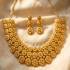 Costume Necklace Set (S72-0693) in gold with floral design, styled on silk fabric – Anjali Jewellers