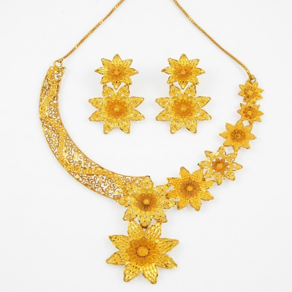 Costume Necklace Set (S72-1301) in gold with floral design, studio product shot – Anjali Jewellers