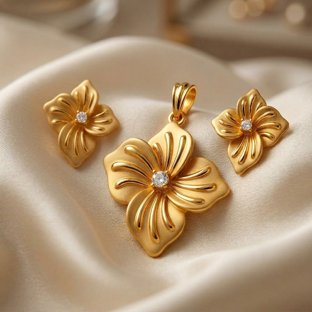 Costume Pendant Set (N64+E66-0351) in gold with floral design, studio product shot – Anjali Jewellers
